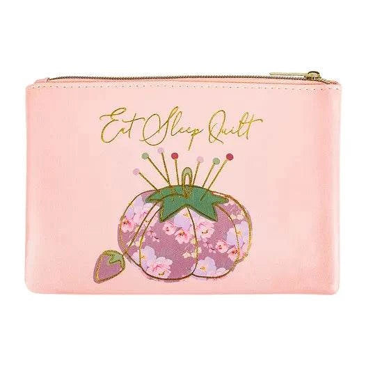 Pink vinyl Glam Bag with "Eat Sleep Quilt" text and floral pincushion design