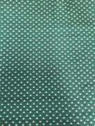 End of Bolt Sale fabric pieces neatly stacked on a table
