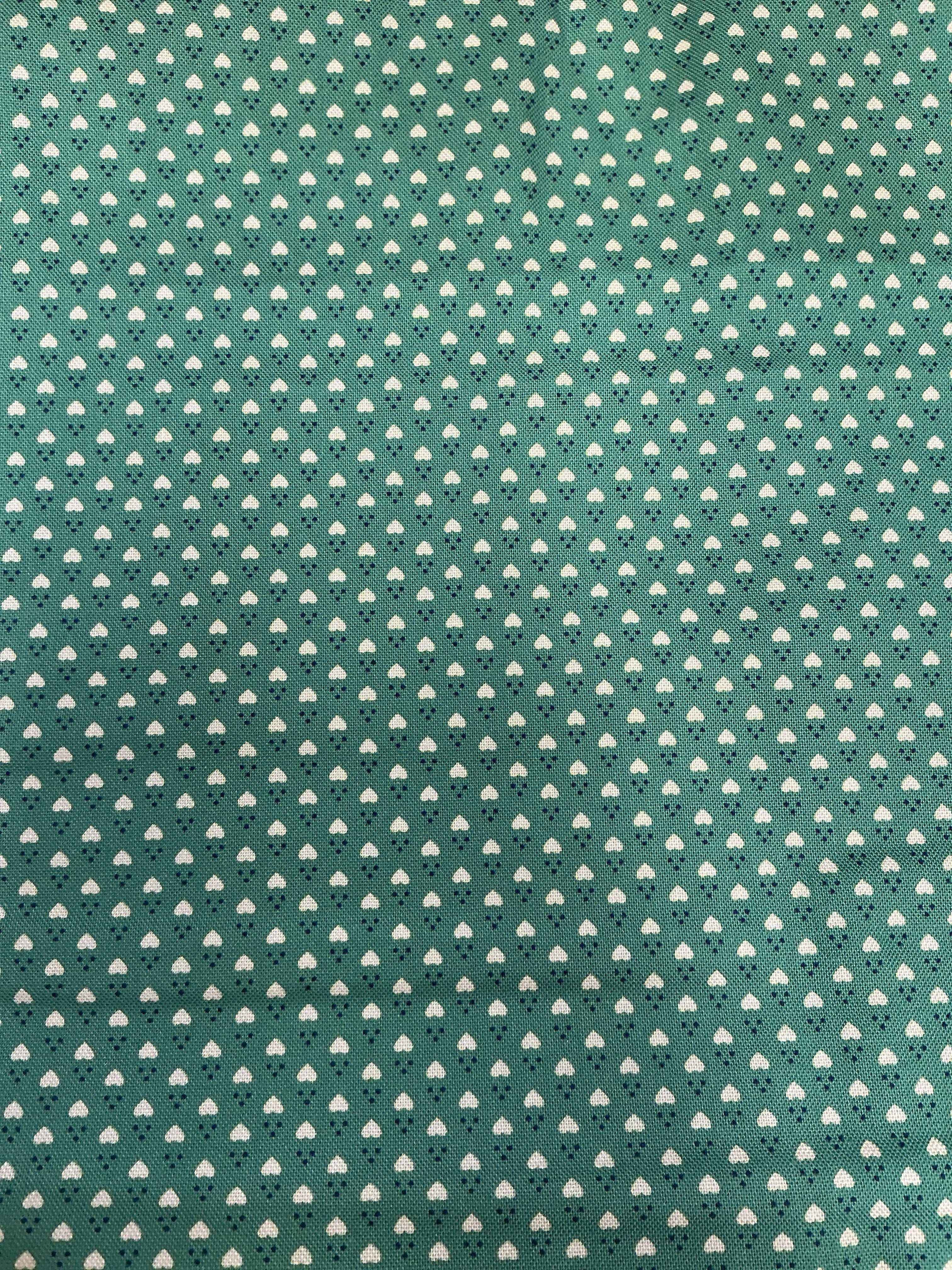 End of Bolt Sale fabric pieces neatly stacked on a table