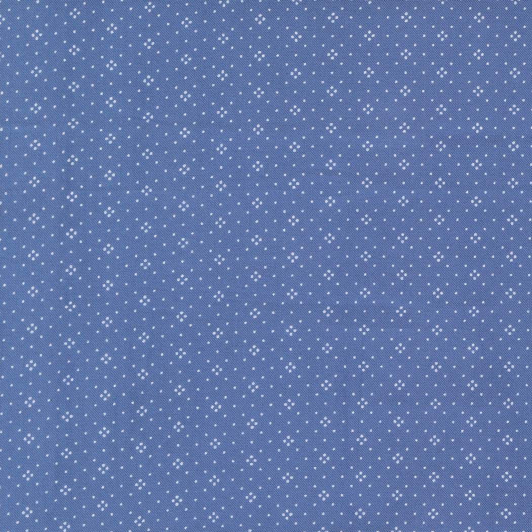 Rosie Eyelet Denim Jeans fabric by Joanna Figueroa for Moda Fabrics in blue with small white eyelet dots pattern