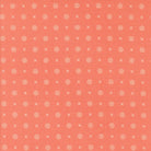 Abloom by Corey Yoder coral fabric with white X and dotted circle pattern for quilting