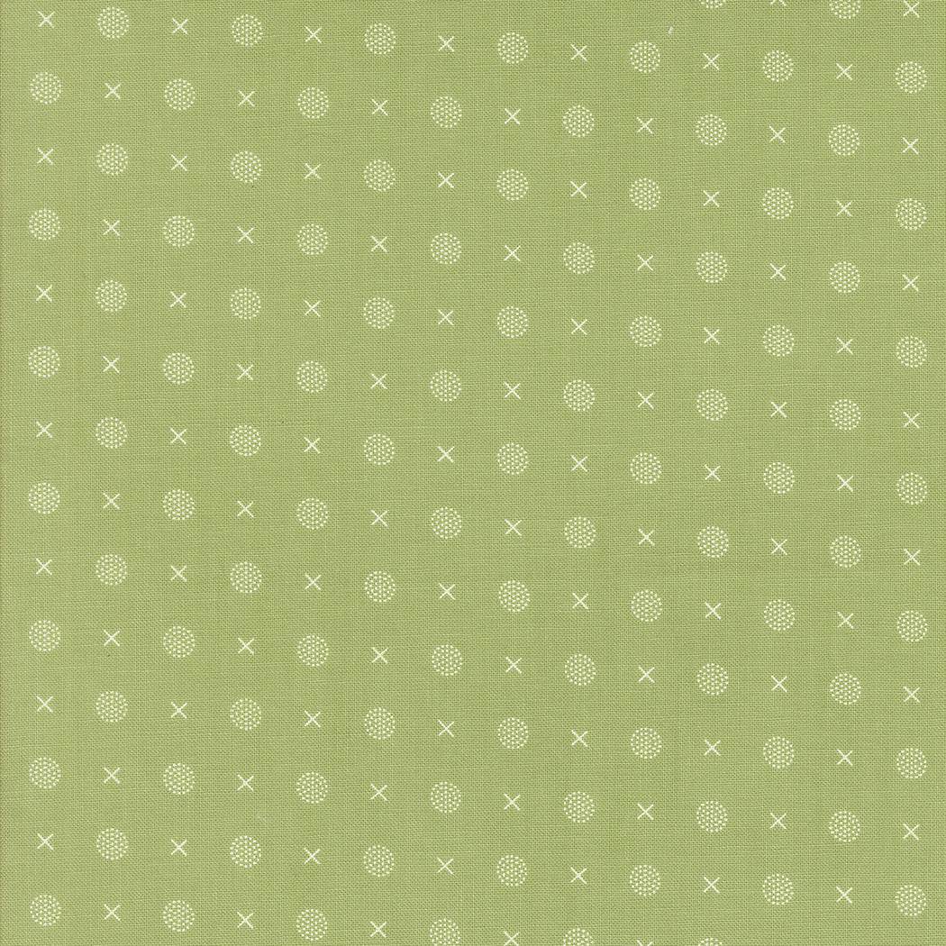 Abloom by Corey Yoder green fabric with white dotted and cross pattern for quilting and crafts