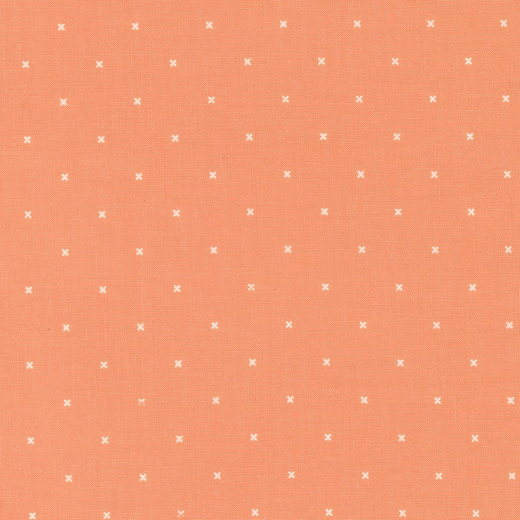 In the Garden Tiny Peel Coral fabric with small white X pattern on coral background by Corey Yoder for Moda Fabrics