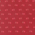 Petals & Polka Dots fabric by Anne Sutton featuring cherry red florals and whimsical dots on a soft pink background