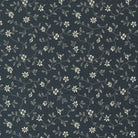 Goodnight Irene fabric by Betsy Chutchian featuring delicate white floral patterns on graphite background
