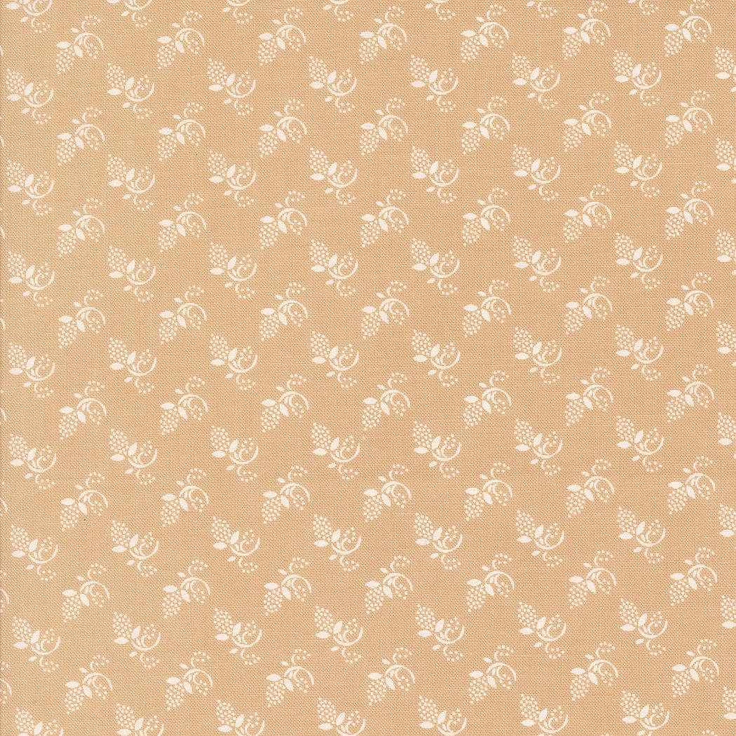 Buon Natale Winter Buds Blenders Sugar Cookie fabric with small white floral pattern on tan background