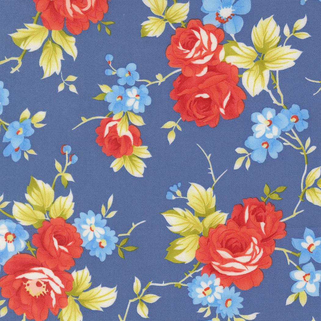 Rosie Country Rose Denim Jeans fabric with red and blue floral pattern on denim blue background