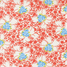 Rosie Nanas Apron fabric by Joanna Figueroa featuring blue and white flowers on a red leafy background for quilting and crafts