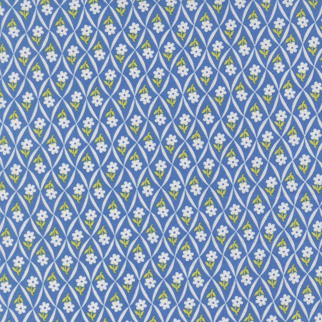 Rosie Climbing Daisy fabric in blueberry blue with small white daisies and green leaves on a lattice pattern
