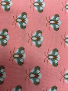 Stack of colorful 5-yard fabric cuts for sale