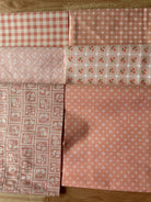 Six quarter yard cuts of Heather Briggs Quarter Yard Color Bundle fabrics from My Sew Quilty Life