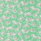 A Cat Named Stitch fabric featuring Georgie Novelty Cat Kitten in green by Camille Roskelley for Moda Fabrics