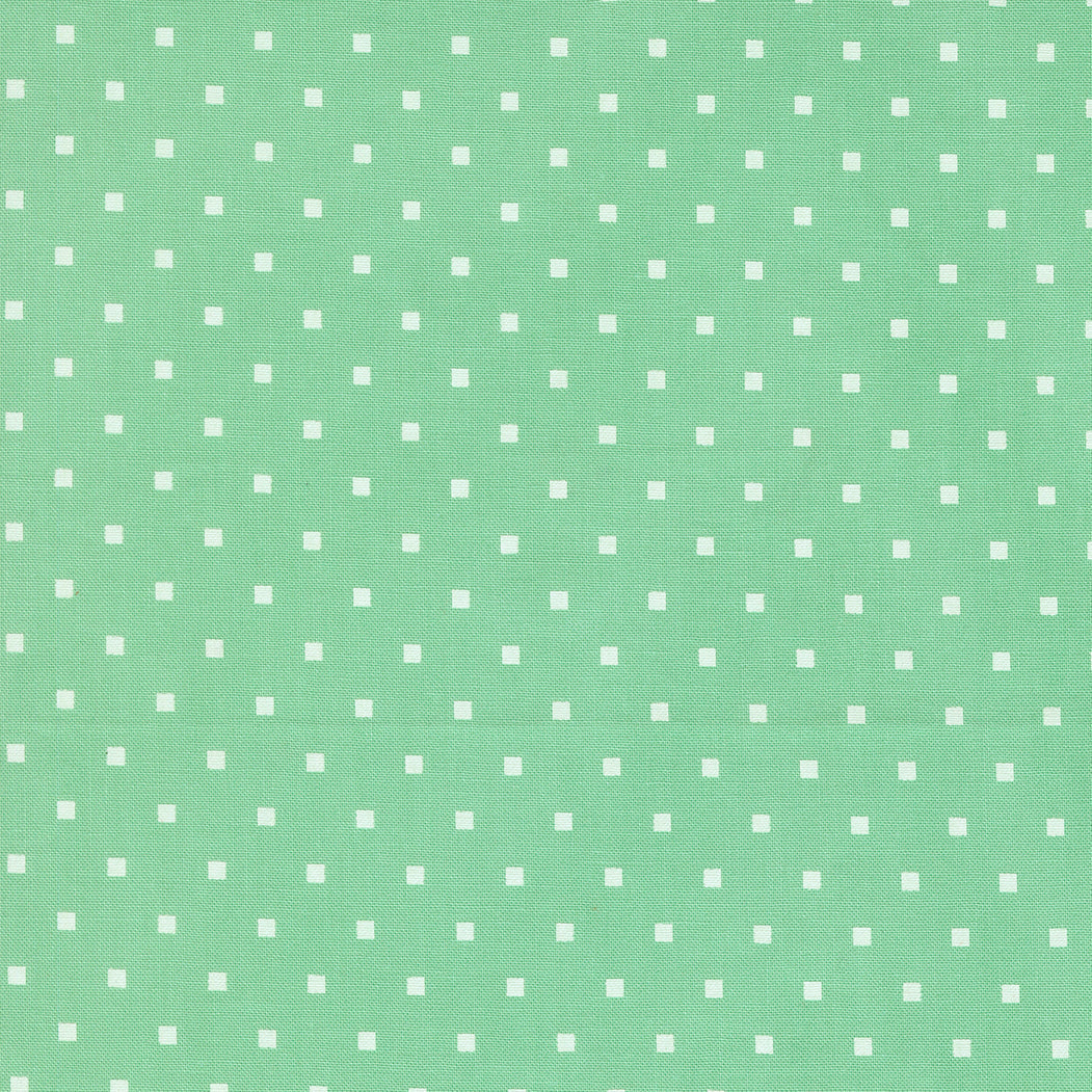 A Cat Named Stitch quilt fabric with green dot pattern by Camille Roskelley for Moda Fabrics