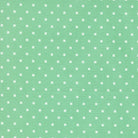 A Cat Named Stitch quilt fabric with green dot pattern by Camille Roskelley for Moda Fabrics