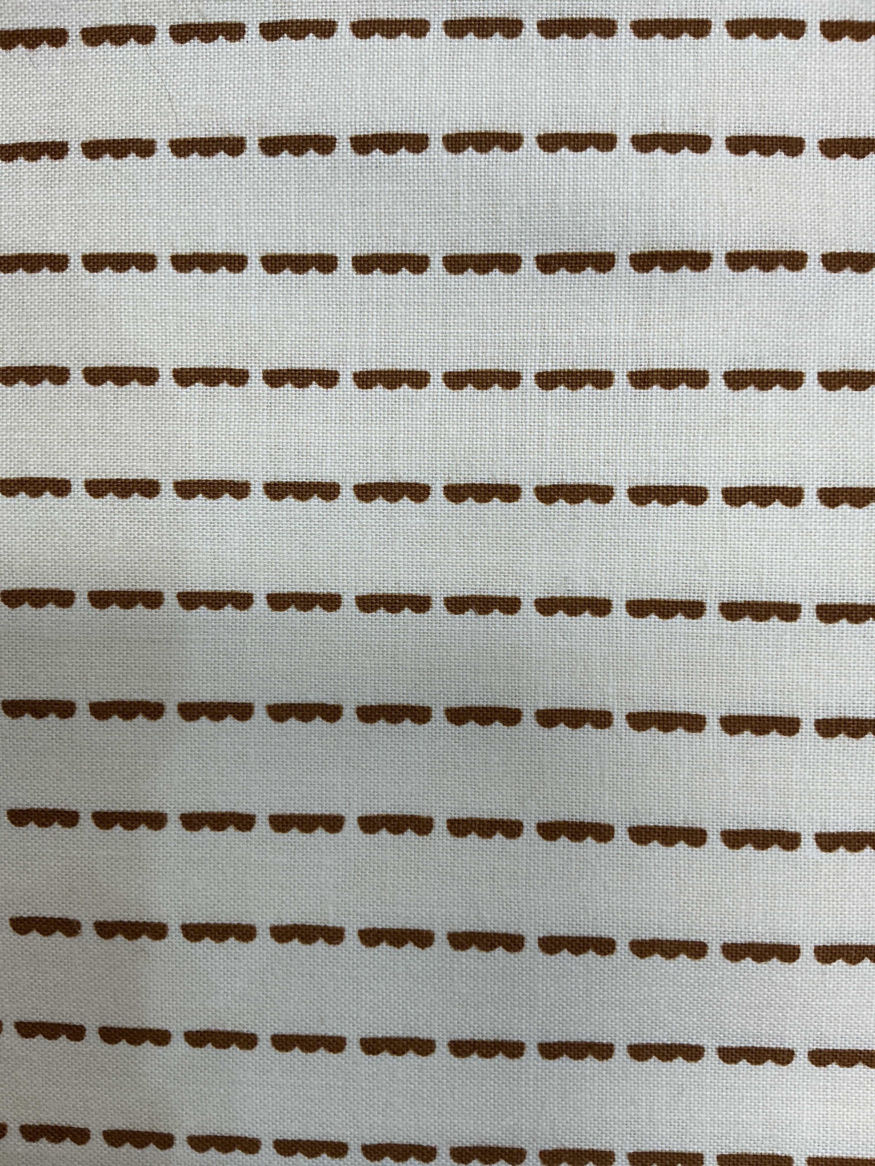 5-yard cuts of fabric on sale with smiling tags