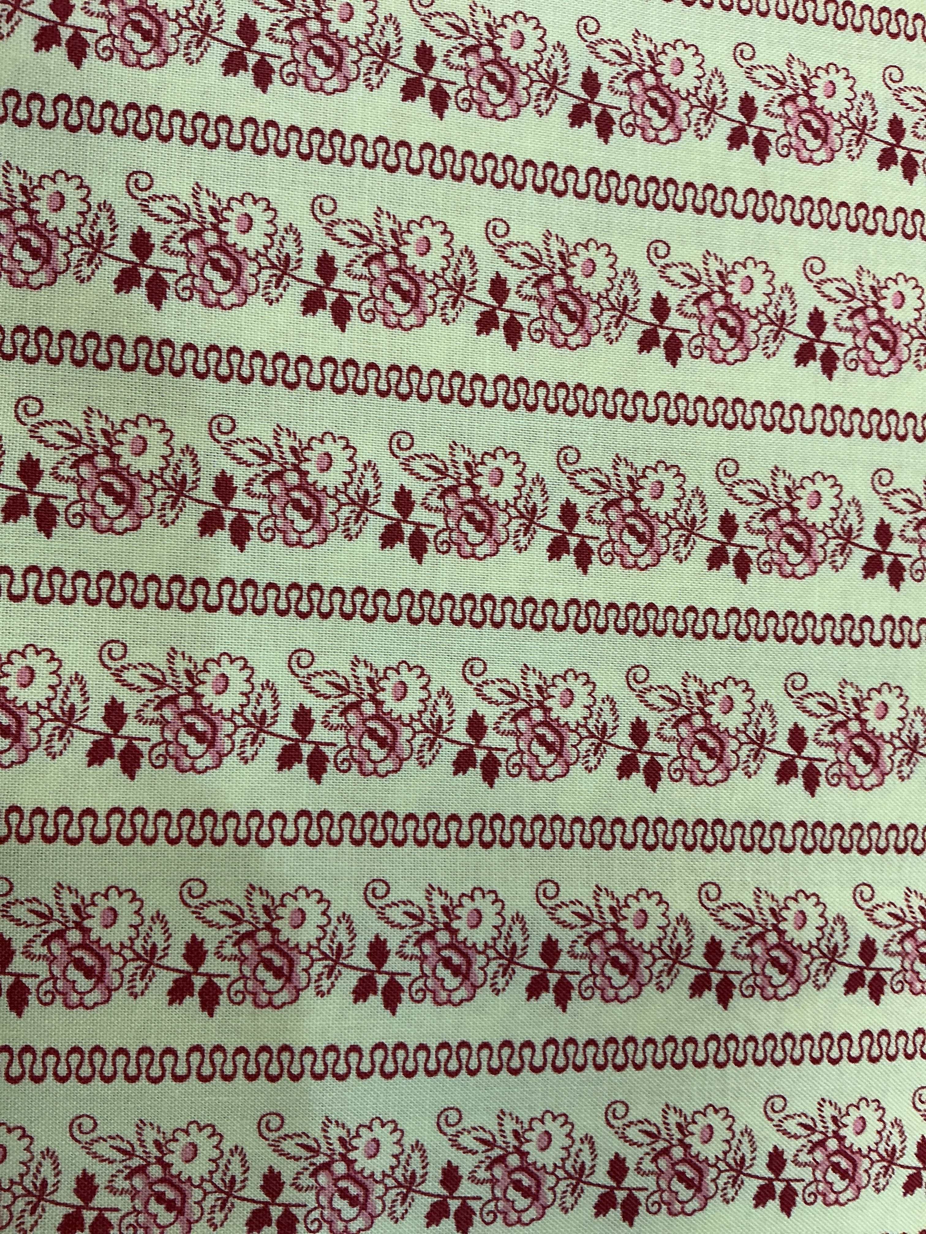 Fabric rolls labeled 5-yard cuts on sale