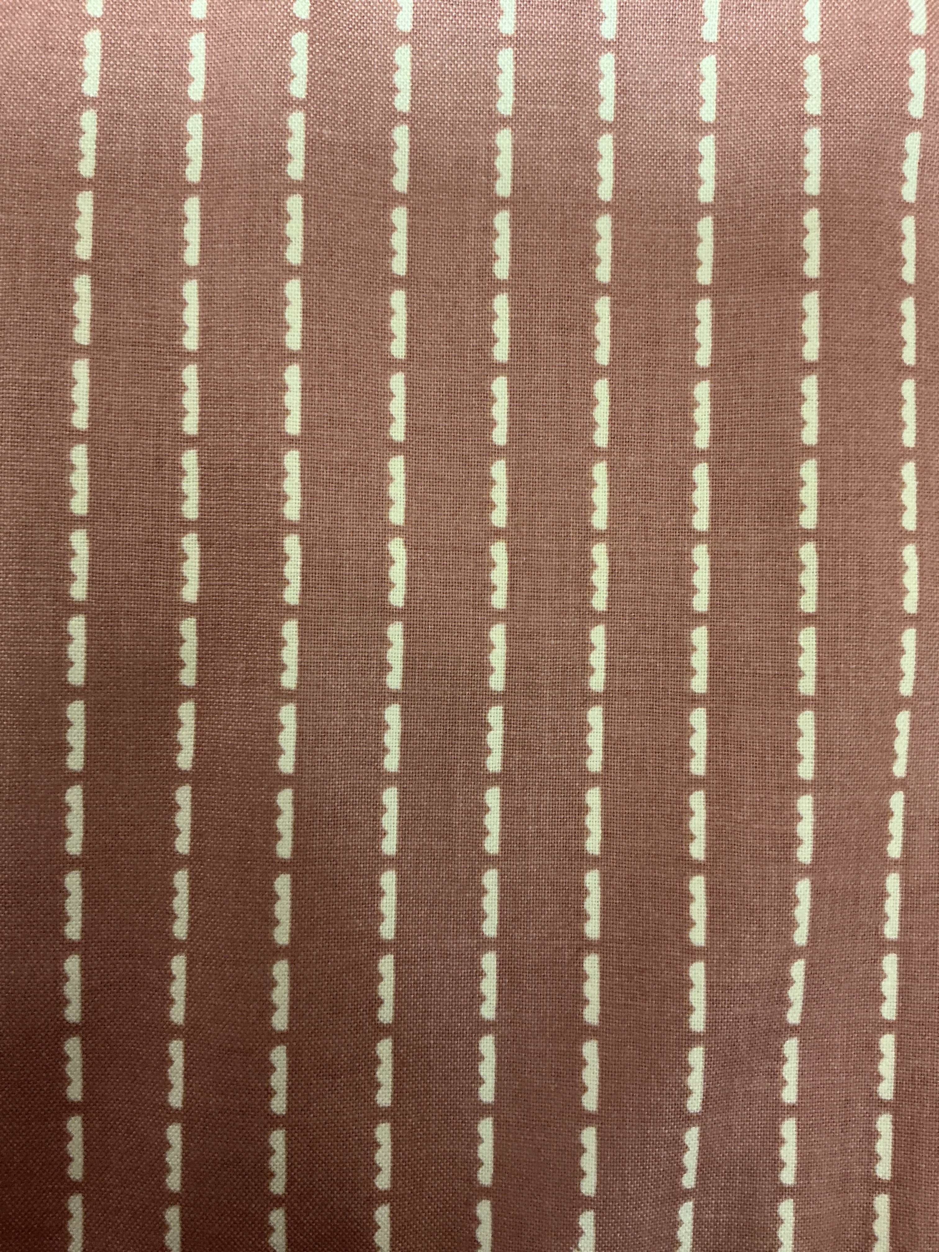 End of Bolt Sale banner with colorful fabric bolts on display