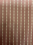 End of Bolt Sale banner with colorful fabric bolts on display