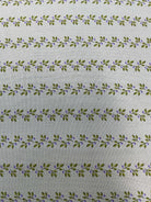Colorful fabric rolls displayed for quilt backing sale at Bella Rose Quilts