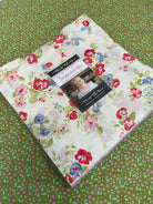 Frida Lap Size Quilt Kit with hollyhocks and roses fabric, pattern, and binding for sew-along project