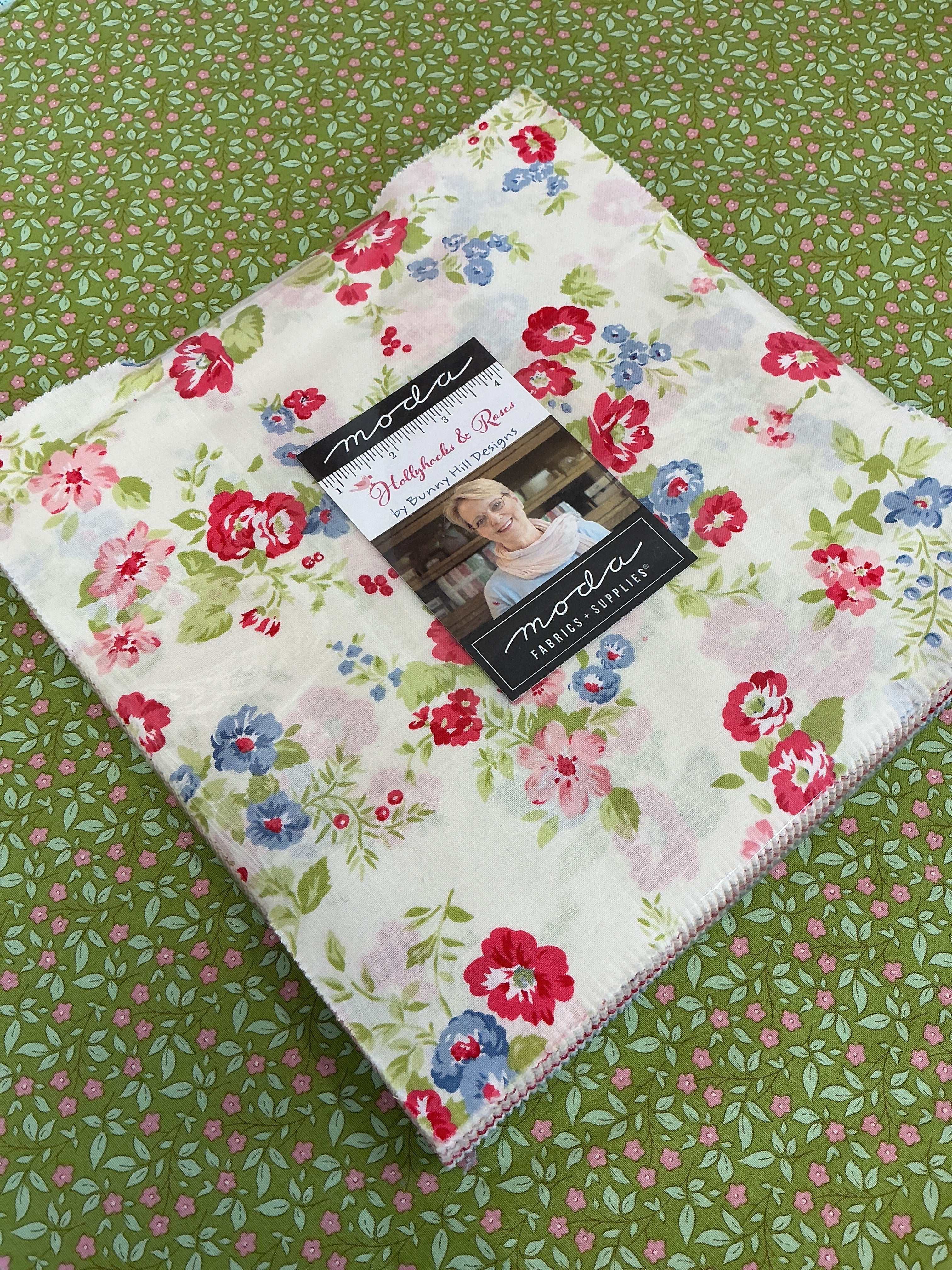 Frida Lap Size Quilt Kit with hollyhocks and roses fabric, pattern, and binding for sew-along project