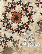 Count Your Crazy Lucky Stars quilt with intricate pieced star patterns by Janet Rae Nesbitt