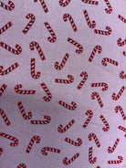 Rolls of 5-yard sale cuts fabric neatly stacked