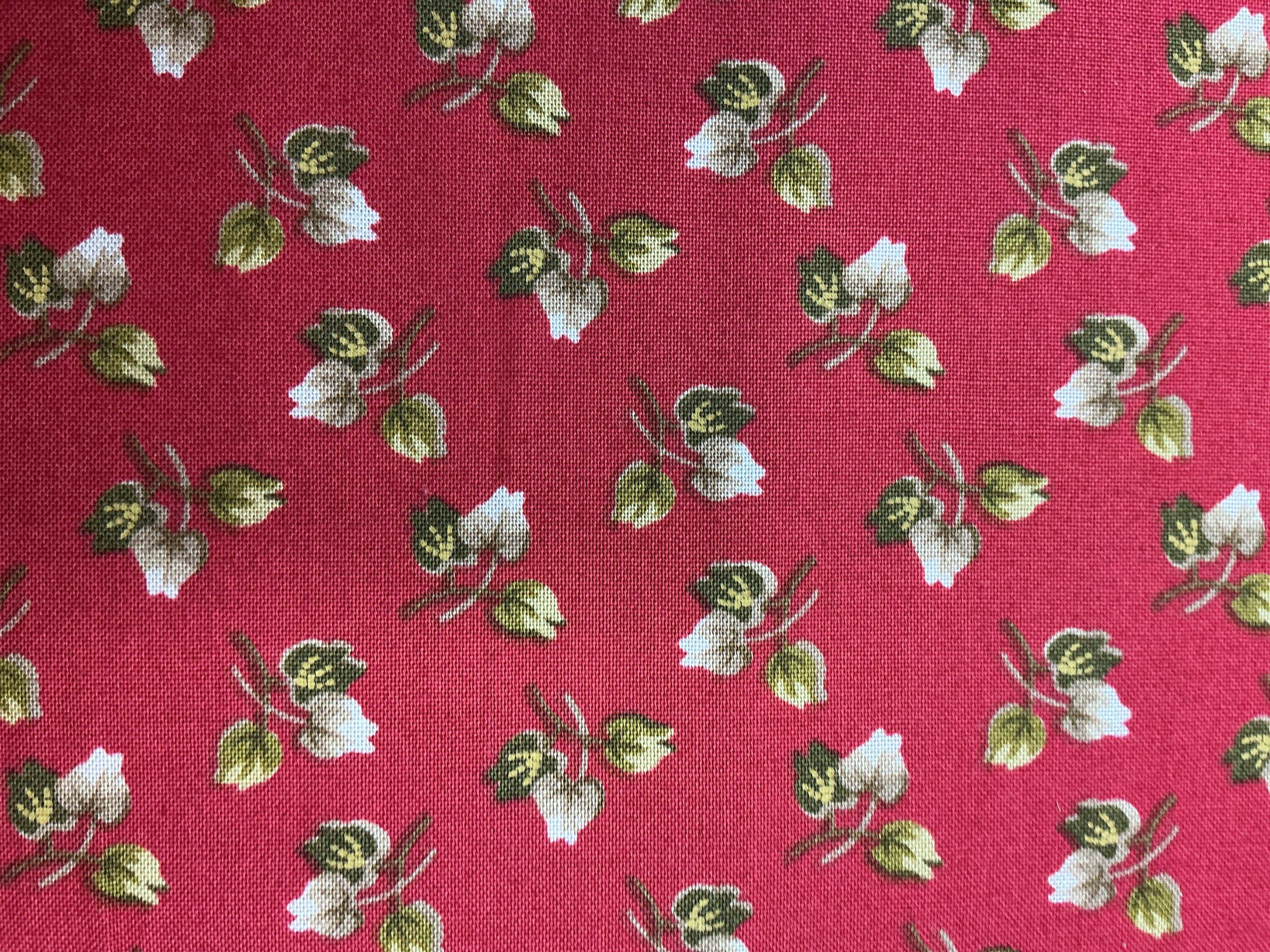 5-yard cuts of fabric for sale laid out on table