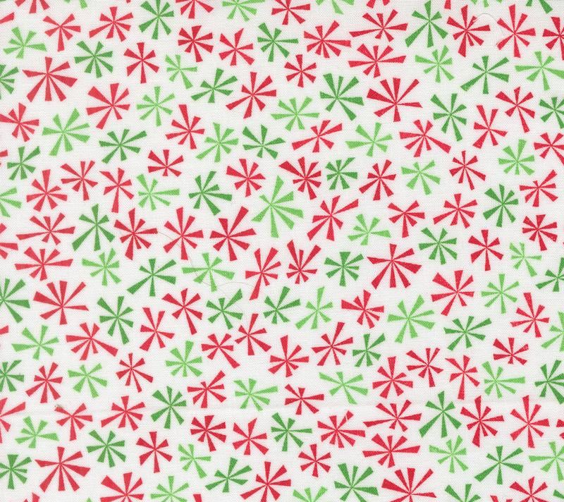 Close-up of Snow Time Winter White fabric with snowmen and holiday motifs by Me & My Sister for Moda Fabrics