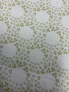 Rolls of 5-yard cuts fabric for sale displayed in a store