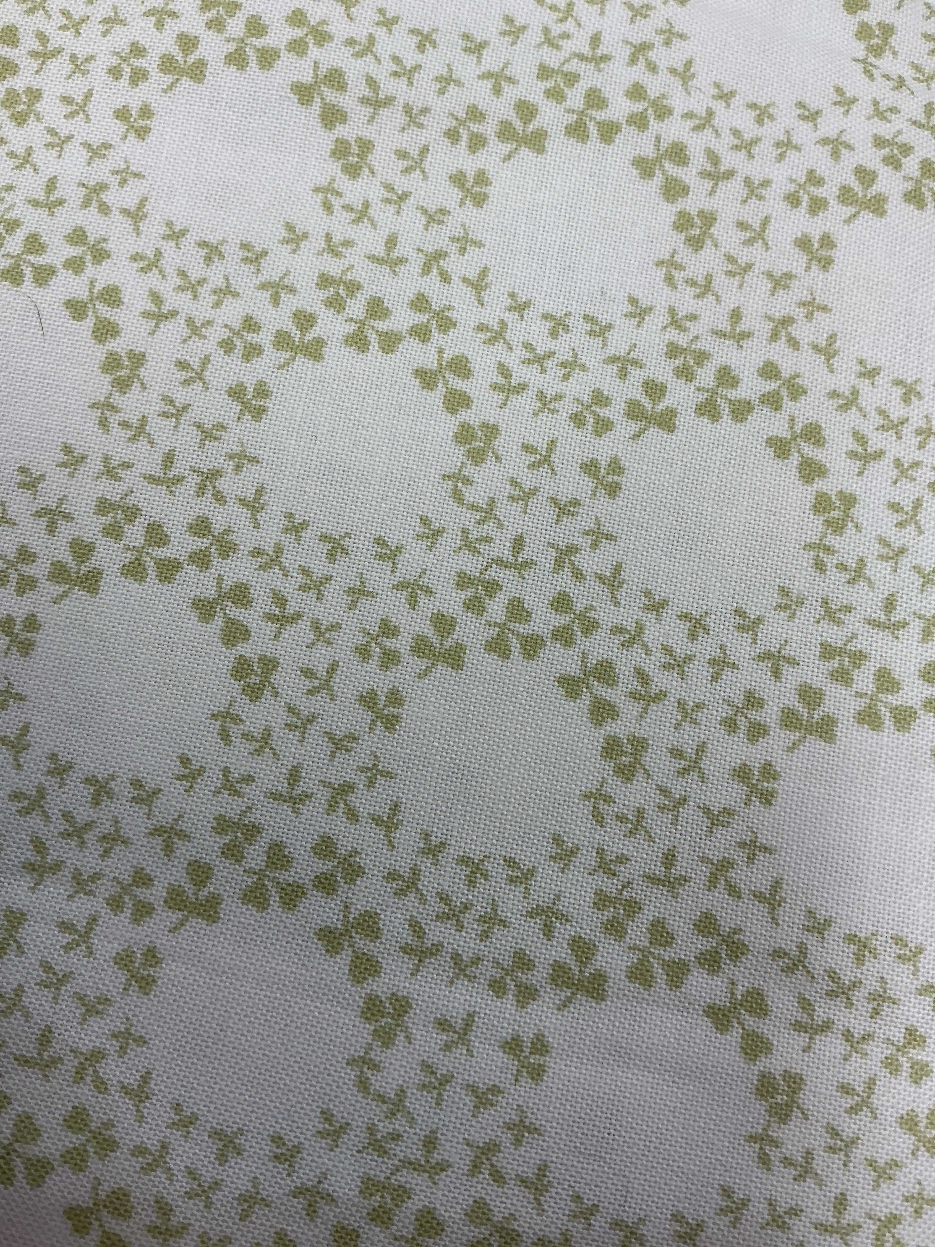 Rolls of 5-yard cuts fabric for sale displayed in a store