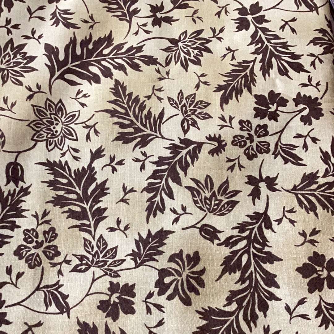Sale Backing BB29 fabric with dark brown floral pattern on beige background
