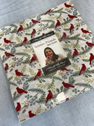 Frida Lap Size Quilt Kit with winter-themed fabrics, digital pattern, and sewing accessories