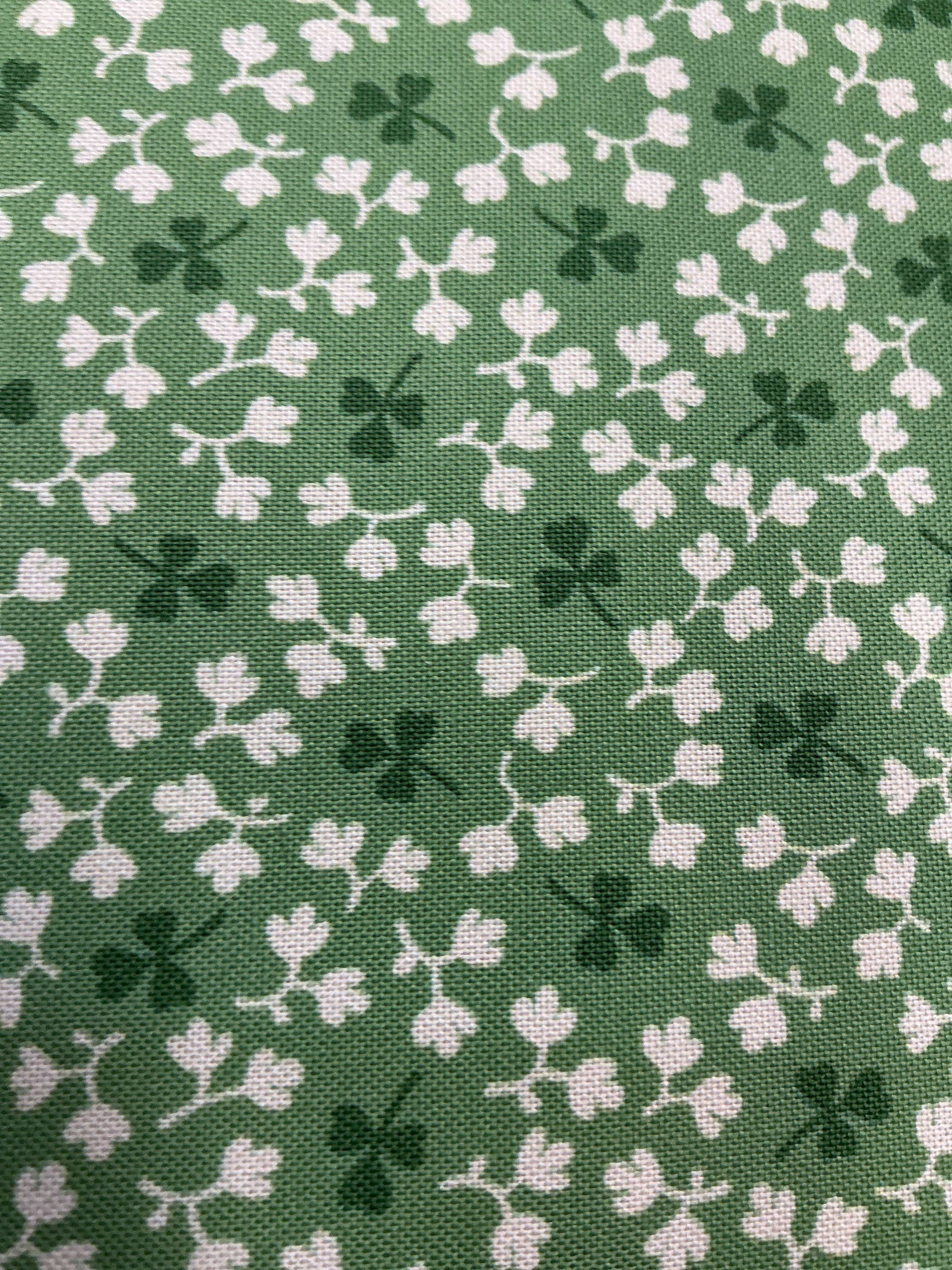 Stack of colorful 5-yard fabric cuts on sale