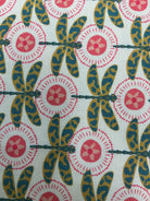 5-yard Cuts fabric sale with colorful fabric rolls stacked