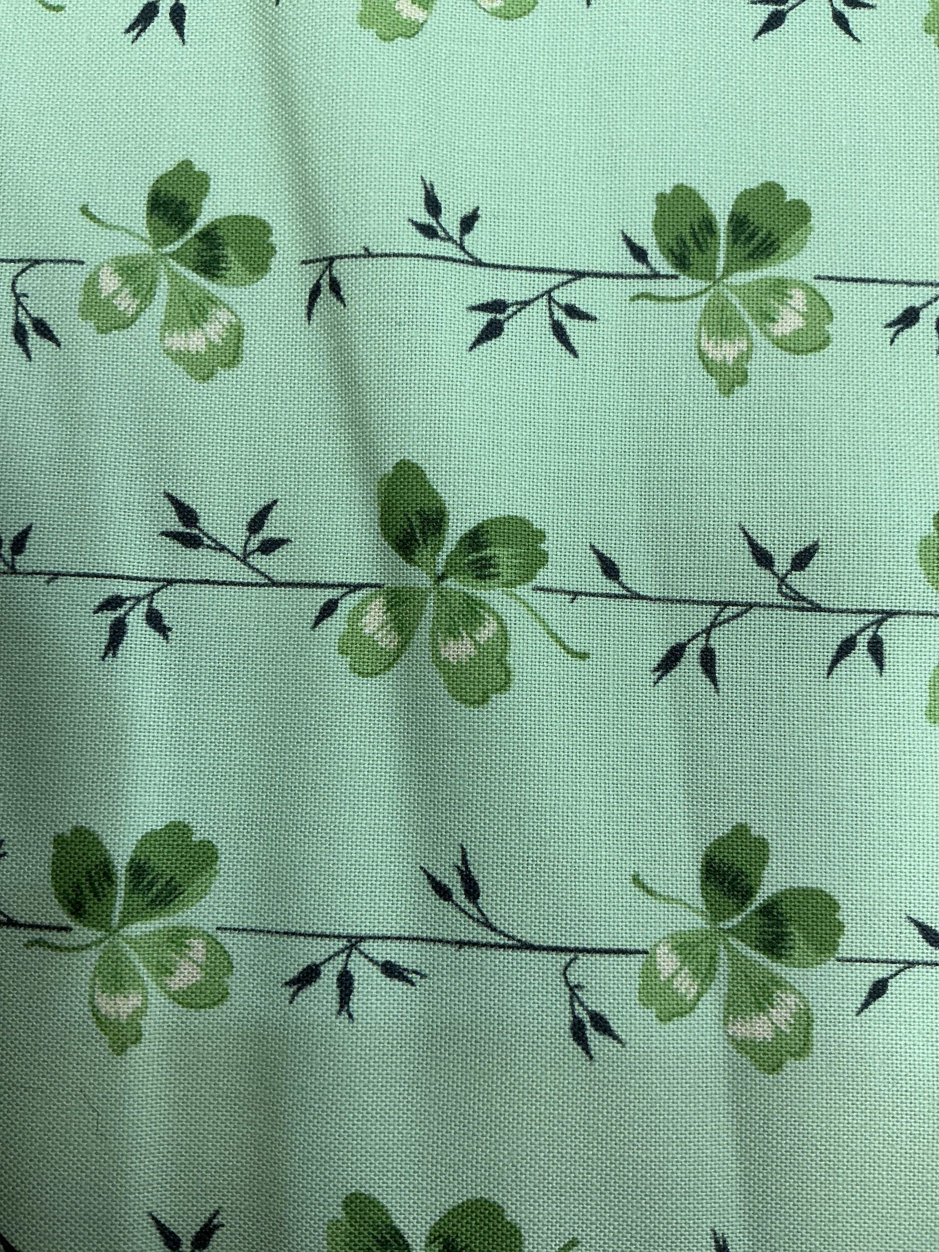 Stack of colorful 5-yard fabric cuts for sale