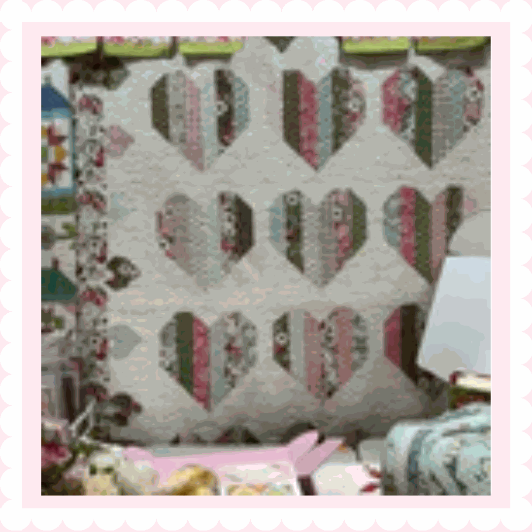 Smitten Quilt Kit by Aria & Ava Quilts with Lovestruck fabric and white dot background, includes pattern and jelly roll for 69x85" throw quilt