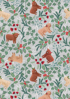 Celtic Christmas fabric with Highland cows, holly, foliage, and gingham on misty silver background