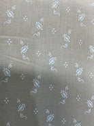 Rolls of fabric labeled 5-yard cuts on sale