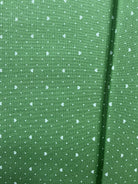 Fabric rolls labeled 5-yard cuts on sale display