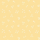 Bunny Blossoms Ditsy Flowers yellow fabric by Dominika Godette with small white floral print on pastel yellow background