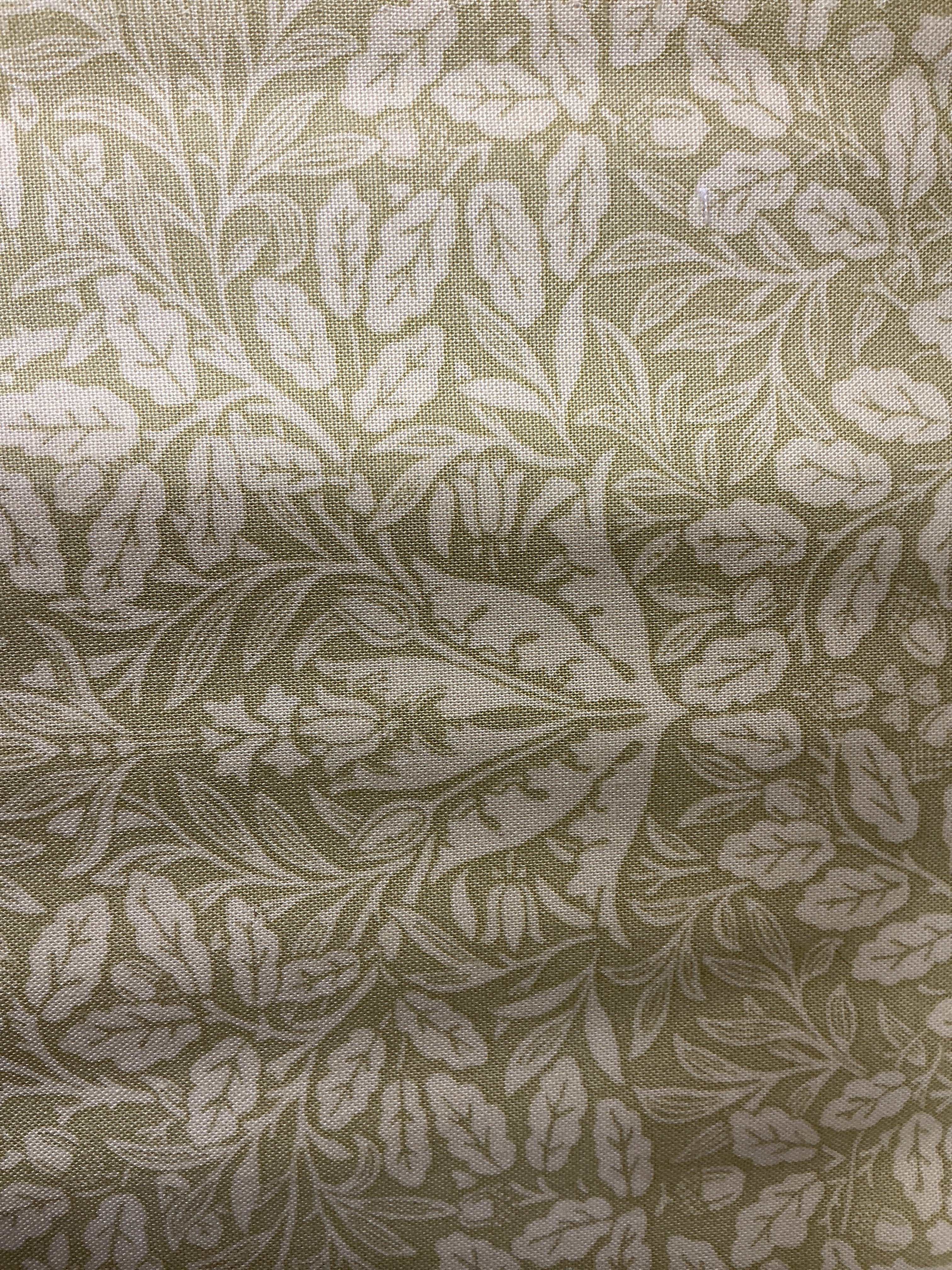 Rolls of colorful fabric labeled 5-yard cuts on sale