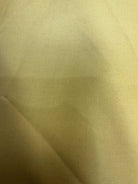 Stack of colorful 5-yard fabric cuts for sale