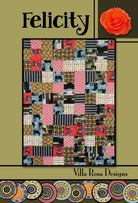 Felicity Pattern quilt design by Villa Rosa Designs with colorful patchwork blocks and floral accents