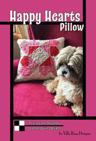 Happy Hearts Pillow quilt pattern with heart design on couch and dog nearby