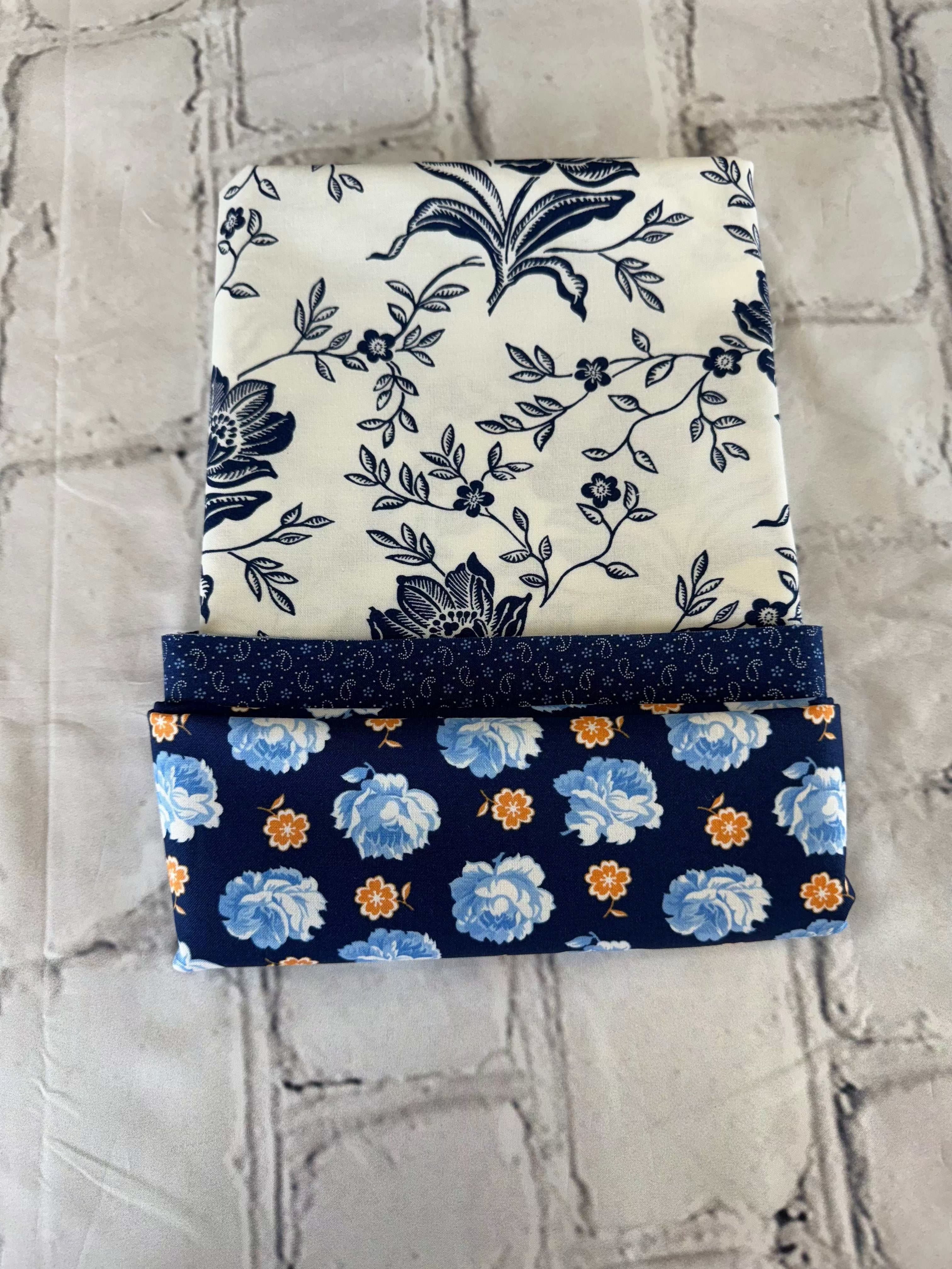 Pillowcase kit with denim and daisy fabric featuring blue floral patterns on white and navy backgrounds