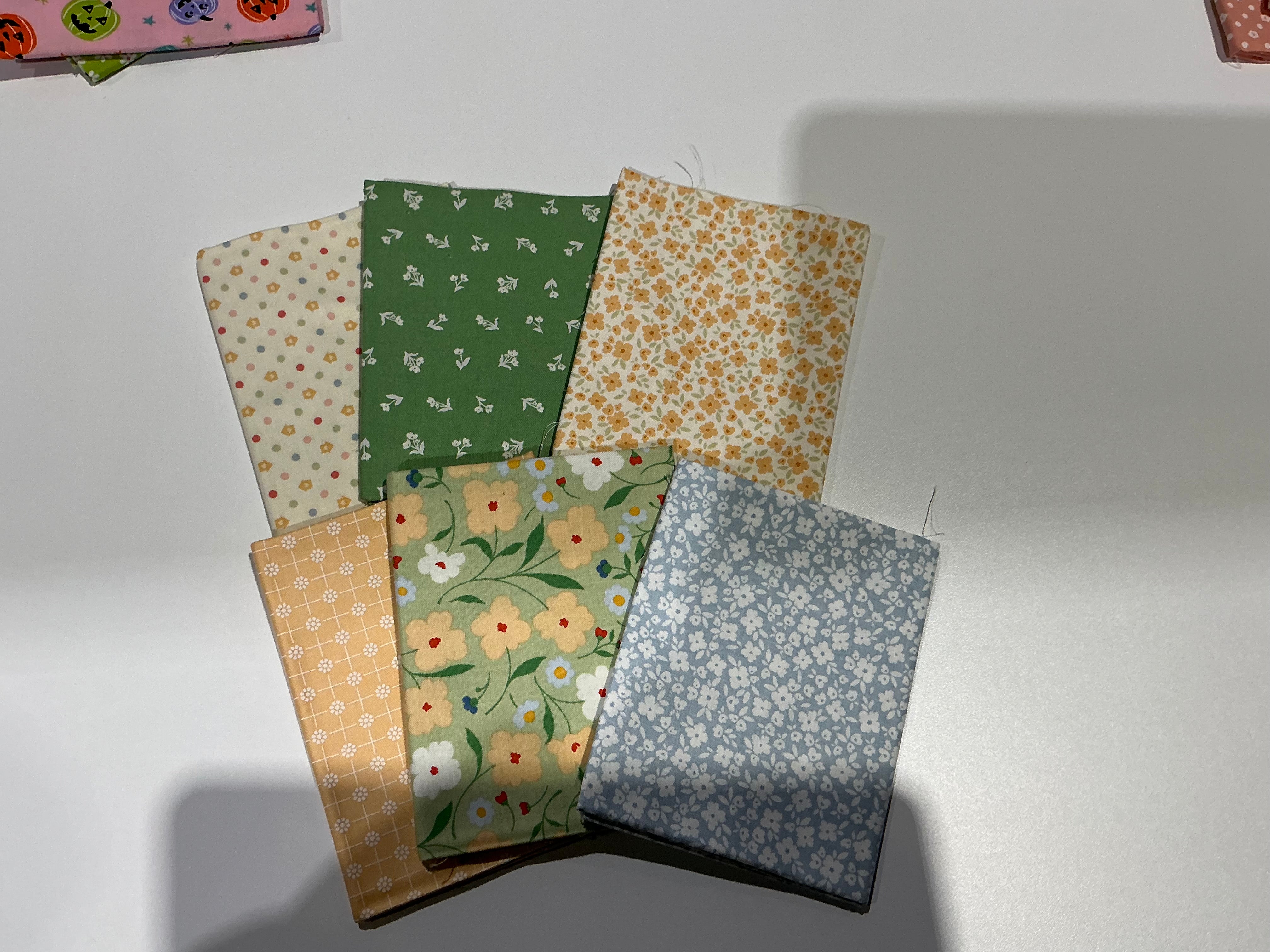 M50 Happy Go Lucky quarter-yard fabric bundle curated by Bella Rose Quilts for mini quilt event