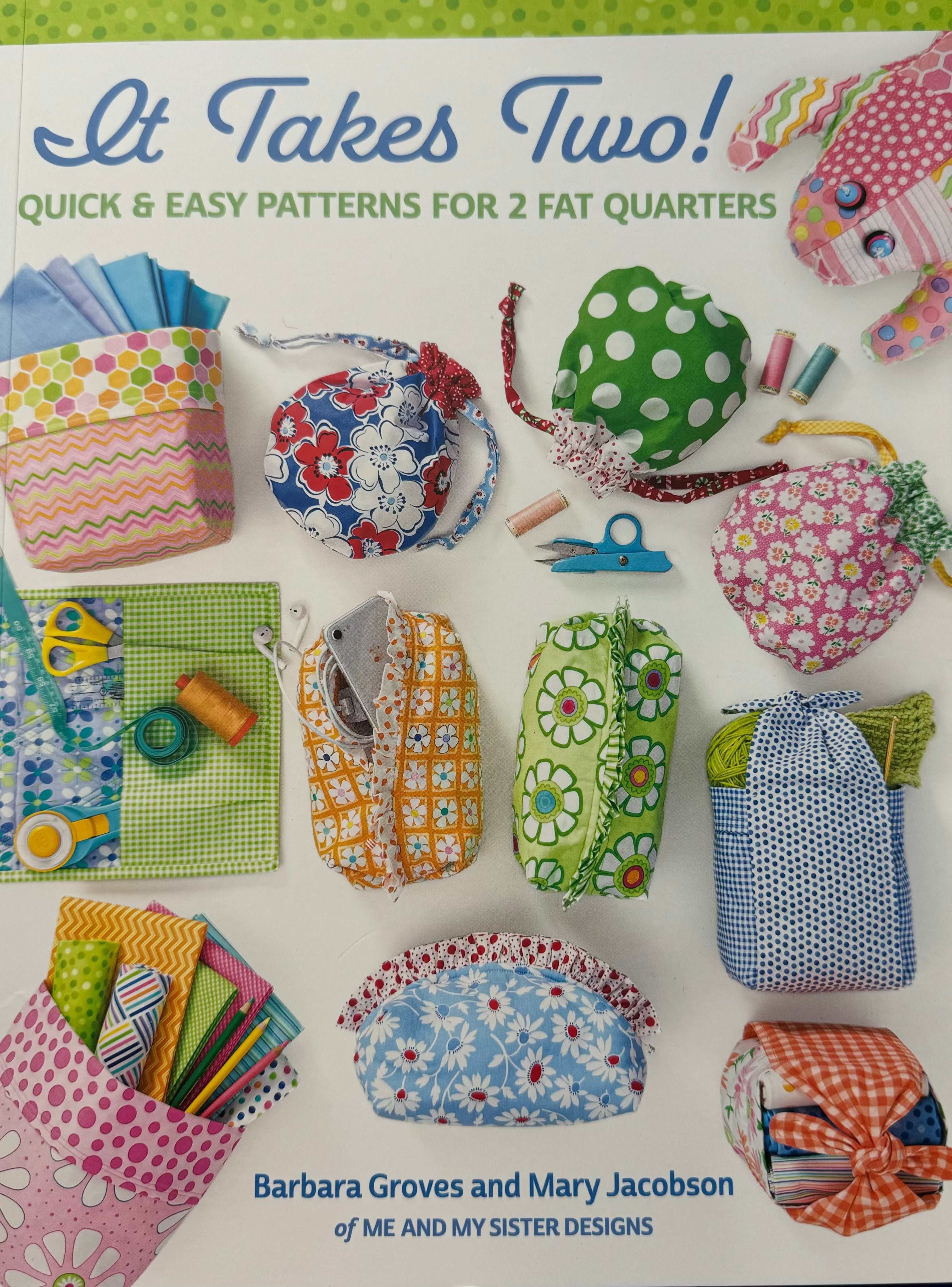 It Takes Two Book by Barbara Groves and Mary Jacobson showcasing quick and easy patterns for 2 fat quarters with colorful fabric crafts and sewing tools