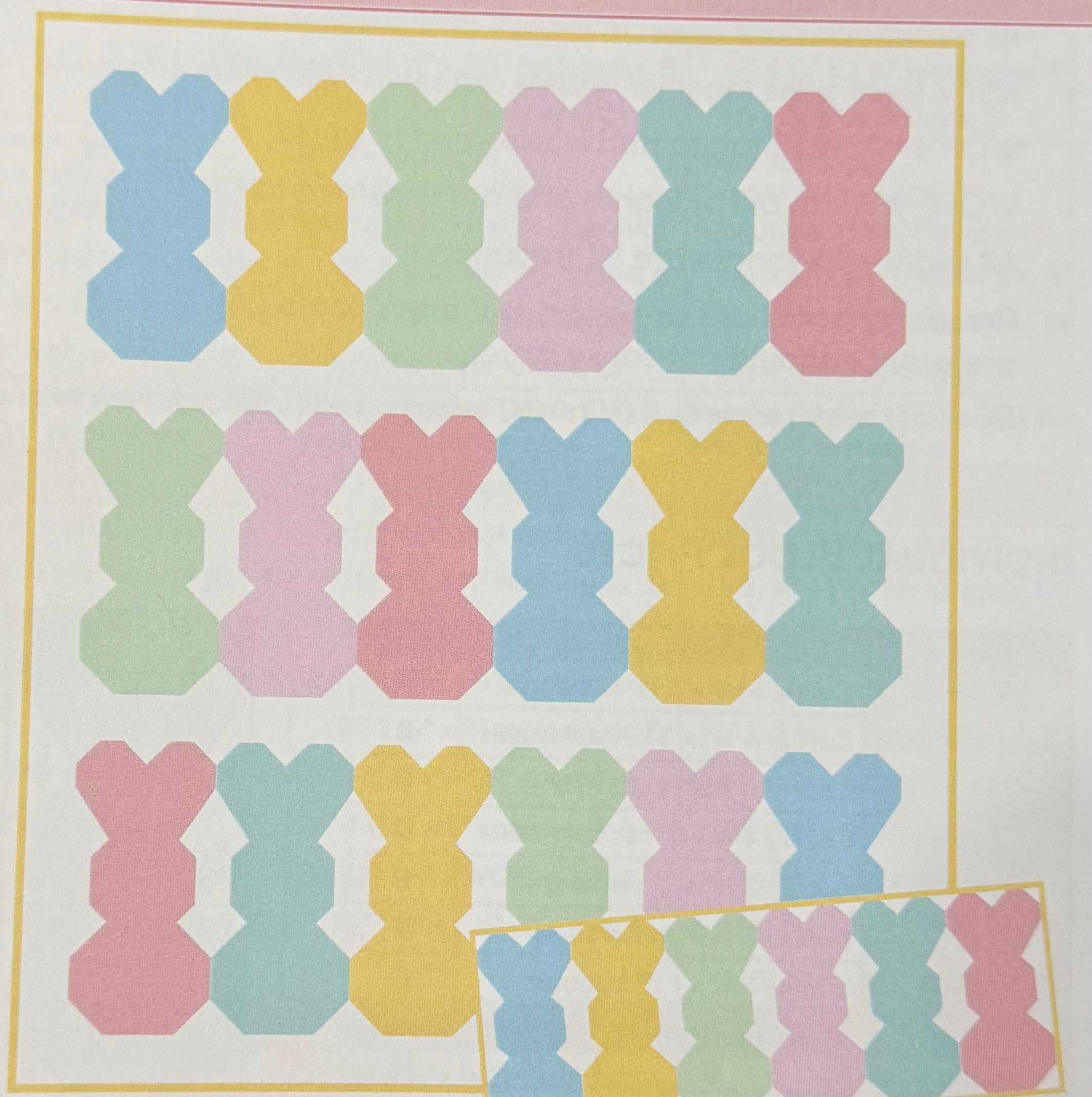 Bunny Fluff Quilt Kit with pastel bunny shapes in a throw size 60x65 inches using Bella Solids from Moda Fabrics