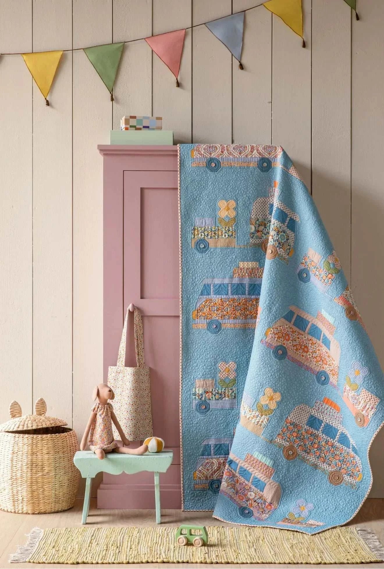 Tilda Wallflower Campervan Quilt KIT with retro campervan design and button wheels in two colorways displayed in cozy room setting